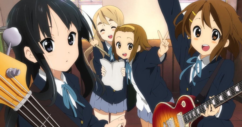 Artwork from K-On showing all of the primary cast posing together with their musical instruments.