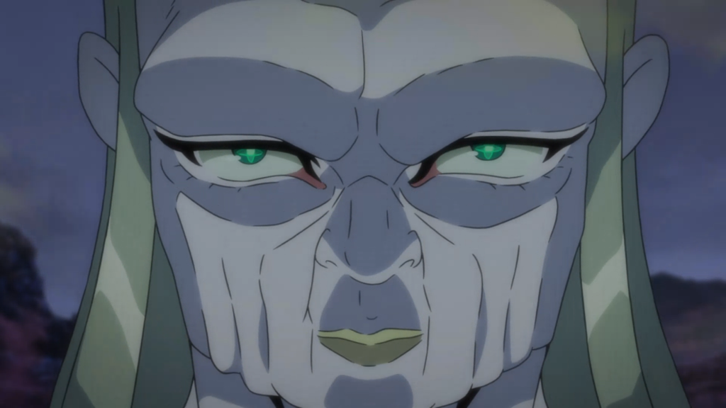 A still from the film showing Muom, the main antagonist. The shot is a close-up of his face, which has a protruding brow. His skin is white, but his eyes and lips are both an ominous green.